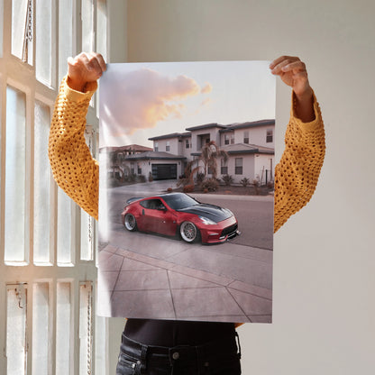 Red Nissan 370z parked in front of modern house poster wall art.