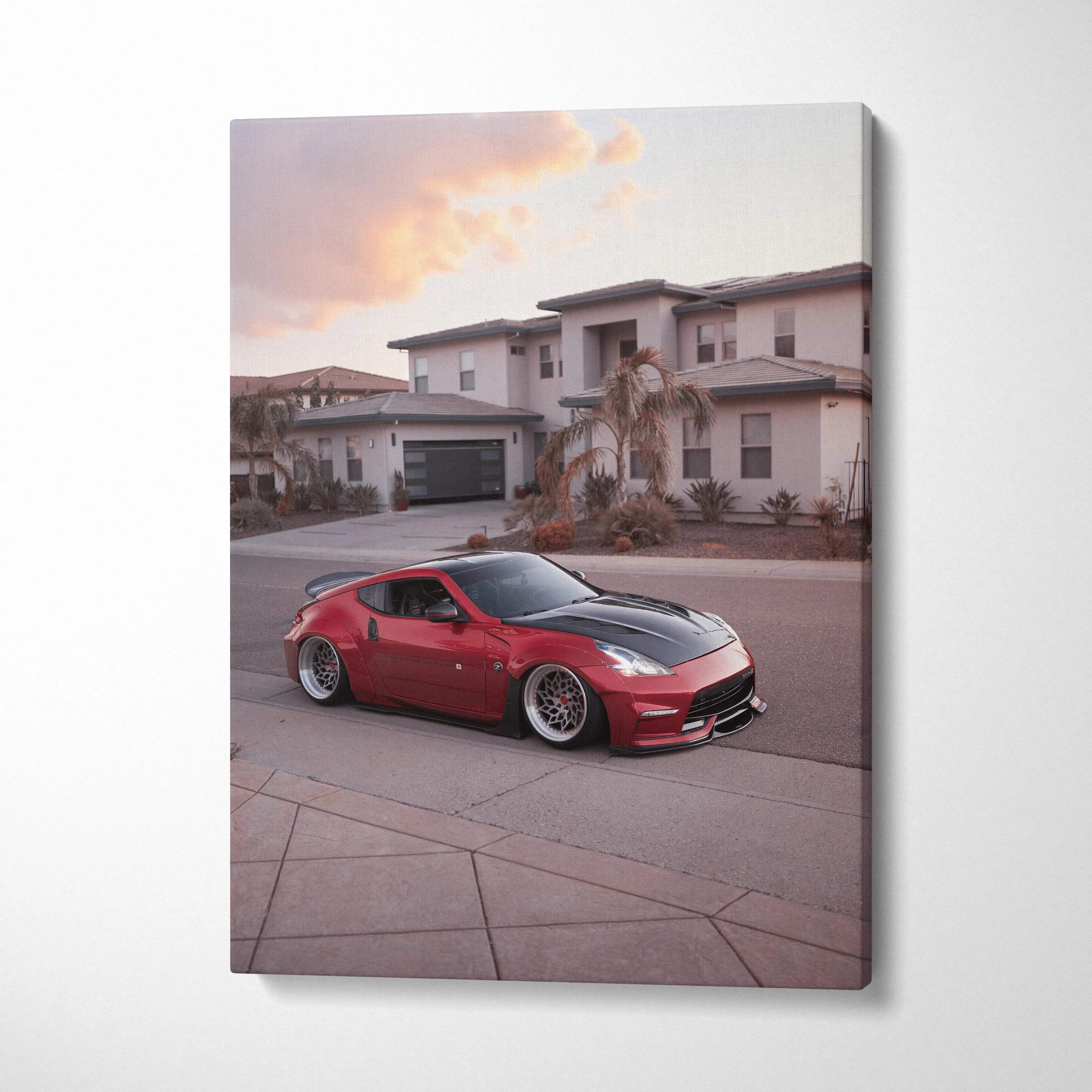 Red Nissan 370z sports car in driveway canvas wall art print with sunset sky background.