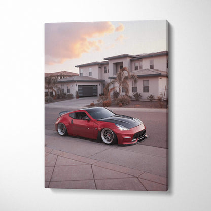 Red Nissan 370z sports car in driveway canvas wall art print with sunset sky background.