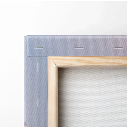 Close-up of wooden frame corner with stretched gray canvas for wall art display.