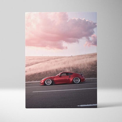 Red Nissan 370z sports car on road at sunset printed on vertical canvas wall art.