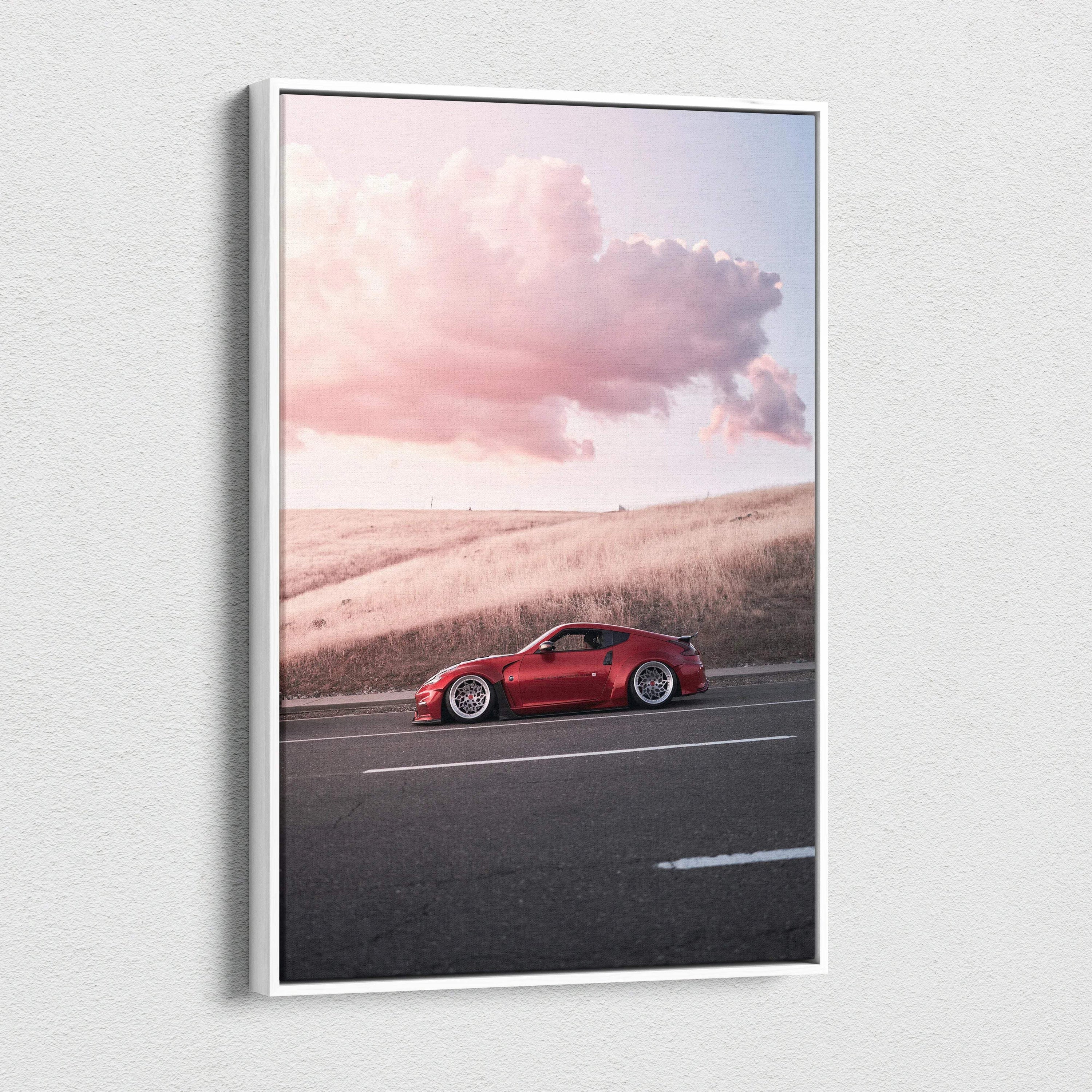Vertical canvas wall art featuring a red Nissan 370z against a soft sunset sky with clouds.