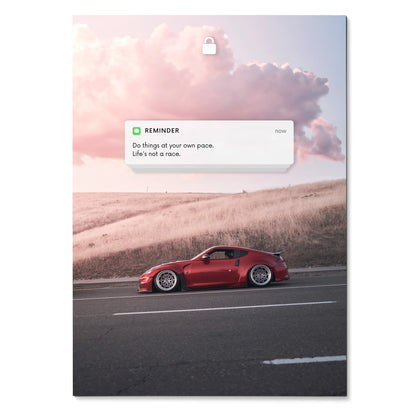 Red Nissan 370z on road at sunset with motivational reminder text poster wall art.