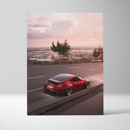 Red Nissan 370z parked on roadside at sunset canvas wall art print in vertical format.