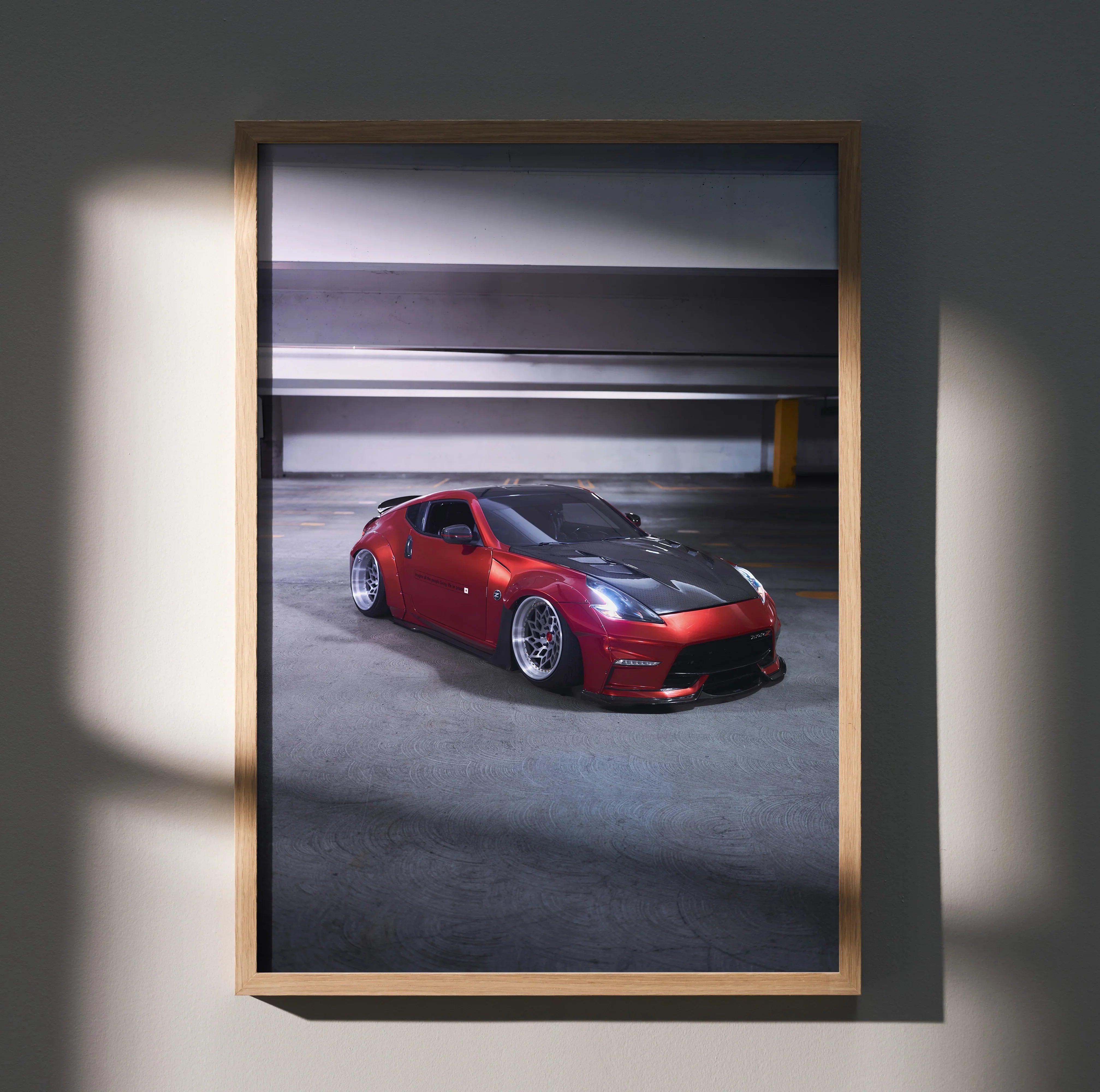 Nissan 370Z red sports car poster framed as stylish wall art with urban parking garage background.