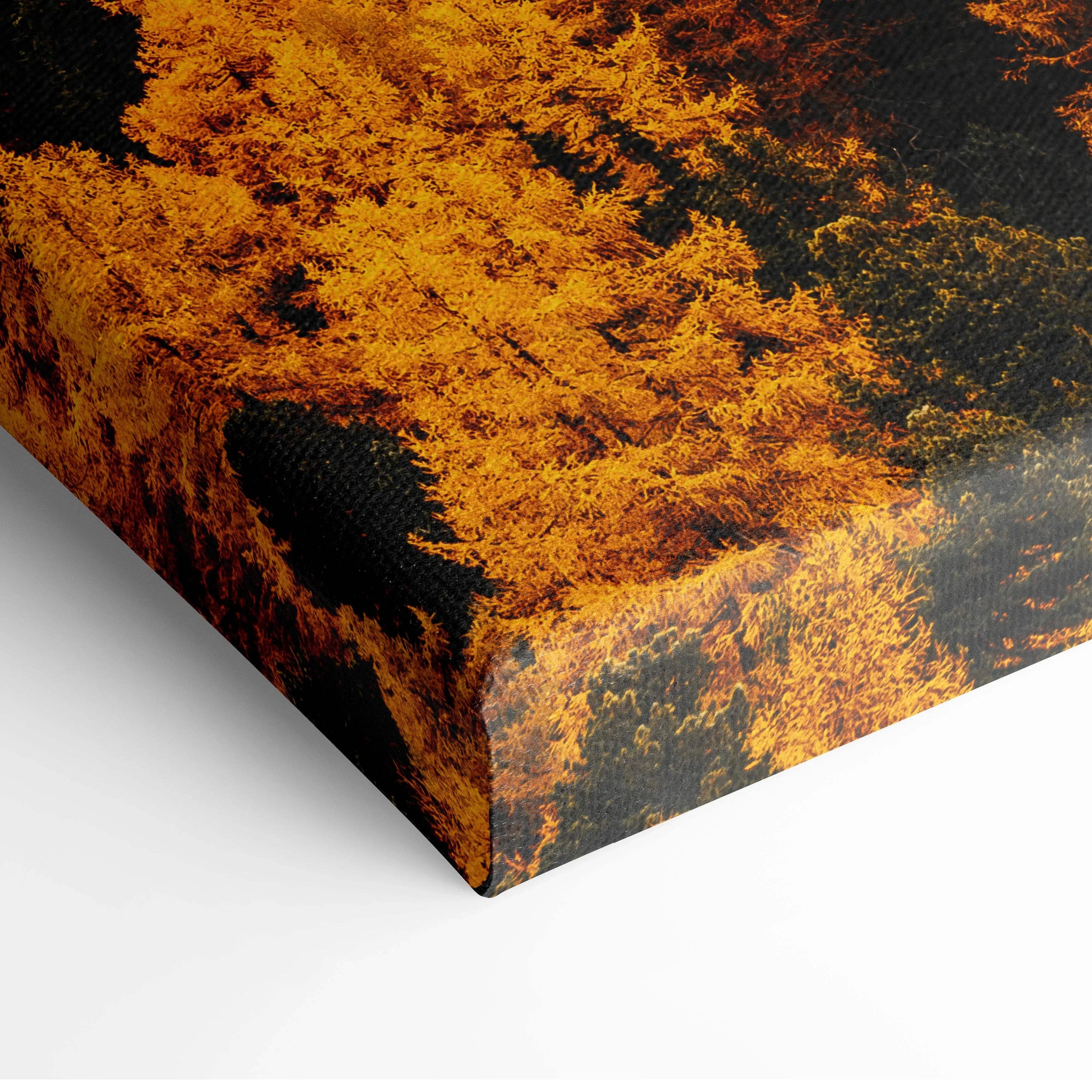 Close-up of vibrant autumn forest foliage on textured canvas wall art with rich orange and yellow hues.