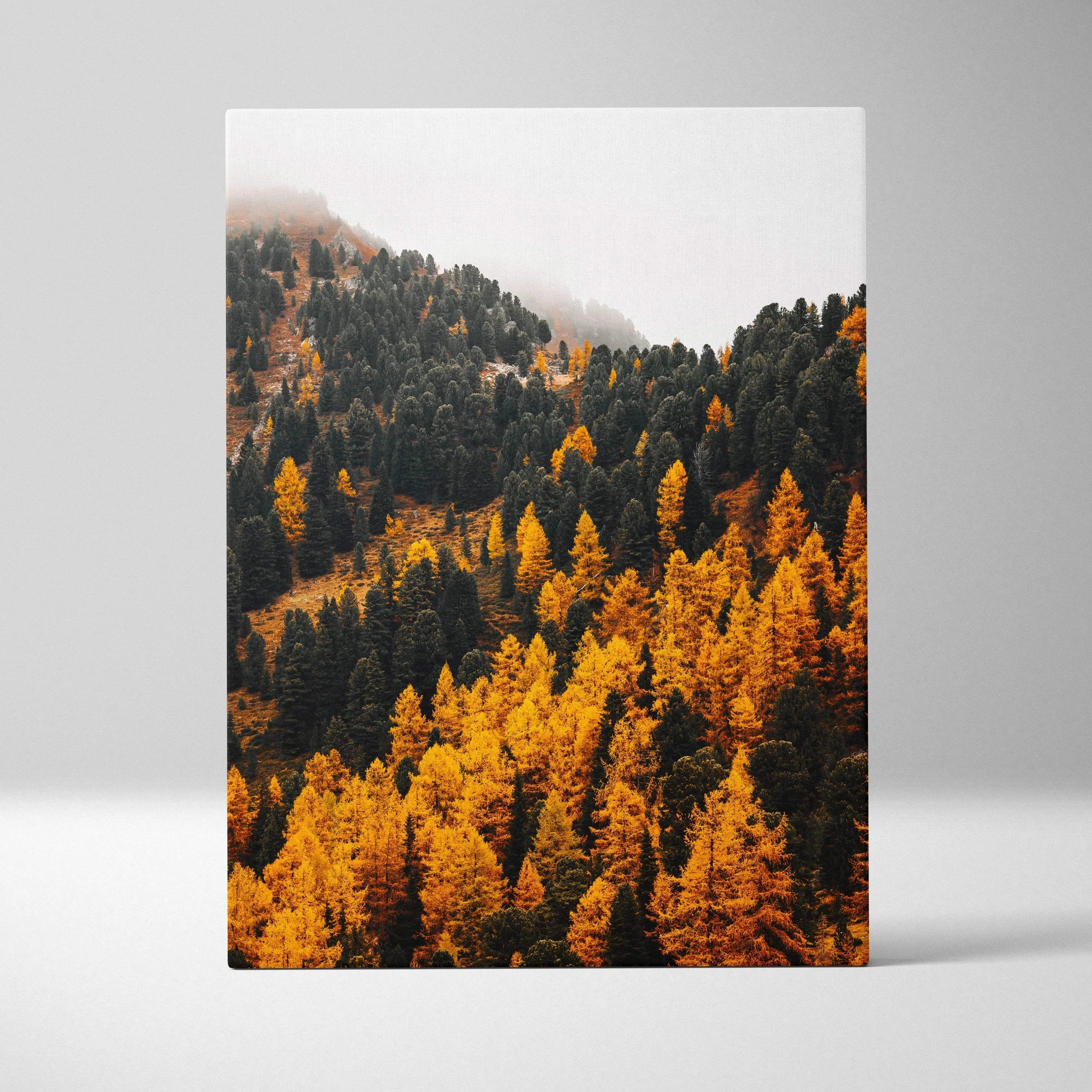 Vertical canvas wall art featuring vibrant autumn trees on mountain slopes with misty sky background.