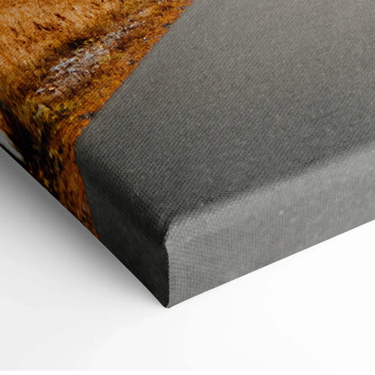 Close-up of canvas art corner showing autumn landscape with vibrant fall colors on textured wall art canvas.