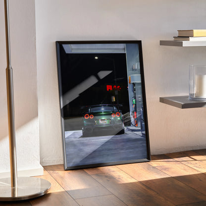 Nissan GTR R35 glowing taillights at night poster wall art in black frame.