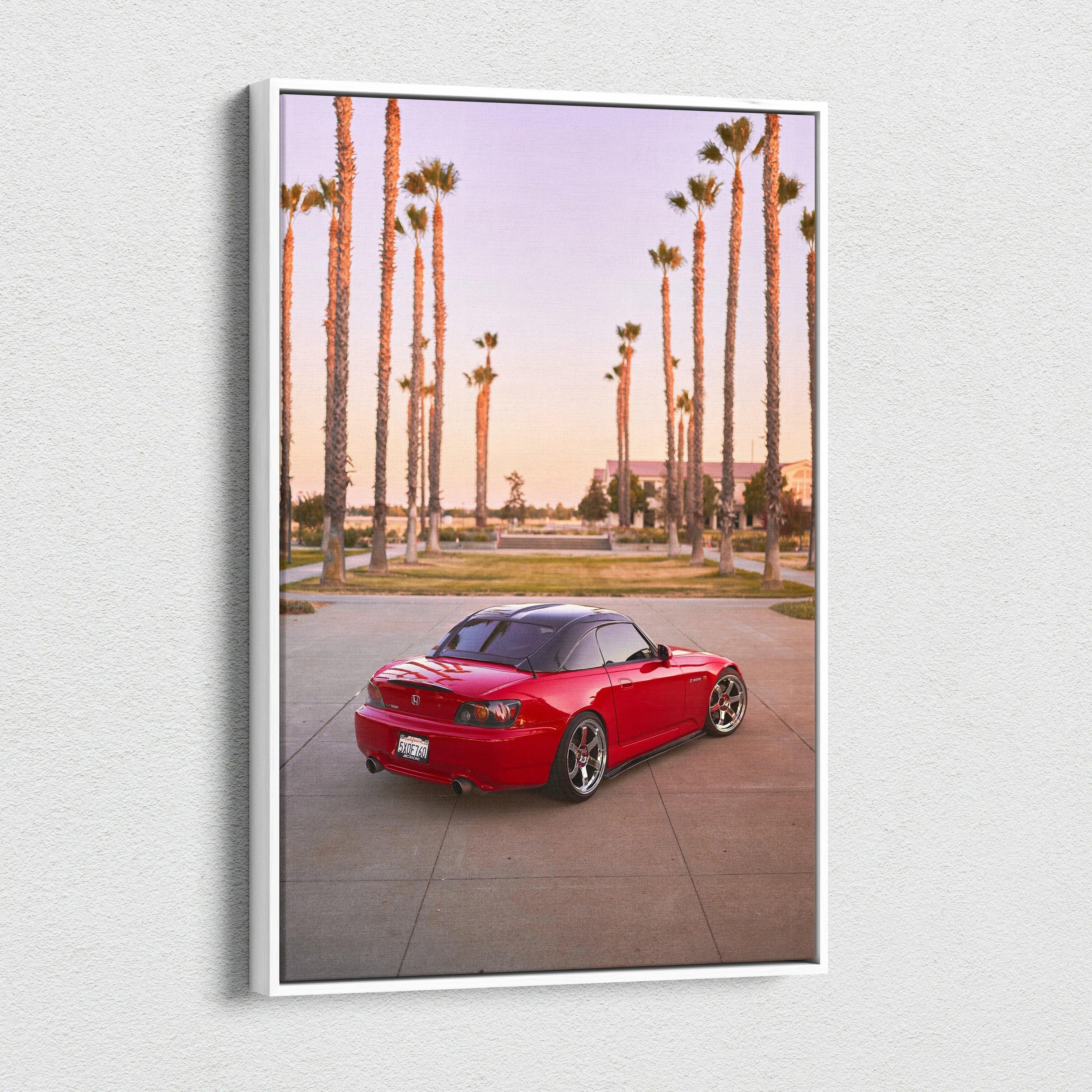 Red Honda S2000 sports car parked on road with tall palm trees at sunset, vertical canvas wall art.