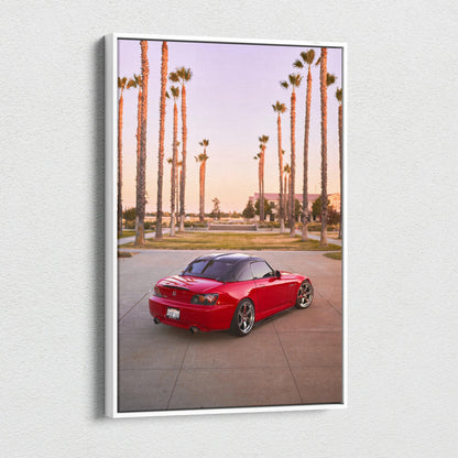 Red Honda S2000 sports car parked on road with tall palm trees at sunset, vertical canvas wall art.