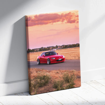 Honda S2000 red sports car on road at sunset vertical canvas wall art with pink sky.