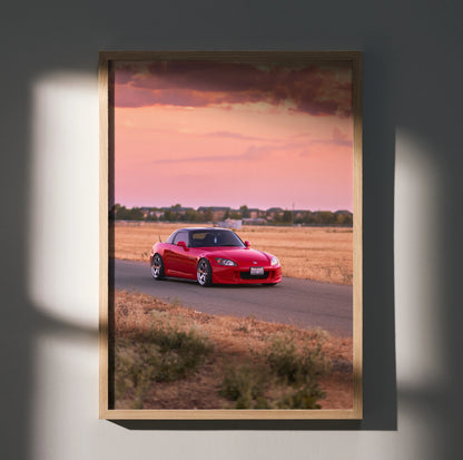 Honda S2000 red sports car driving on road at sunset poster wall art.