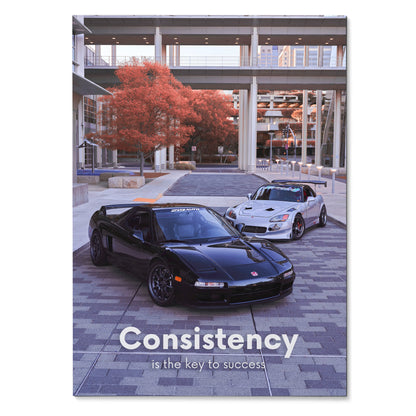 Poster wall art featuring black Acura NSX and white Honda S2000 under urban overpass with red-leaved tree and "Consistency.