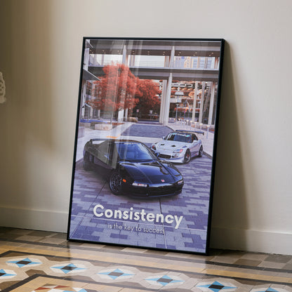 Motivational poster wall art featuring Acura NSX and Honda S2000 with "Consistency" text in urban setting.