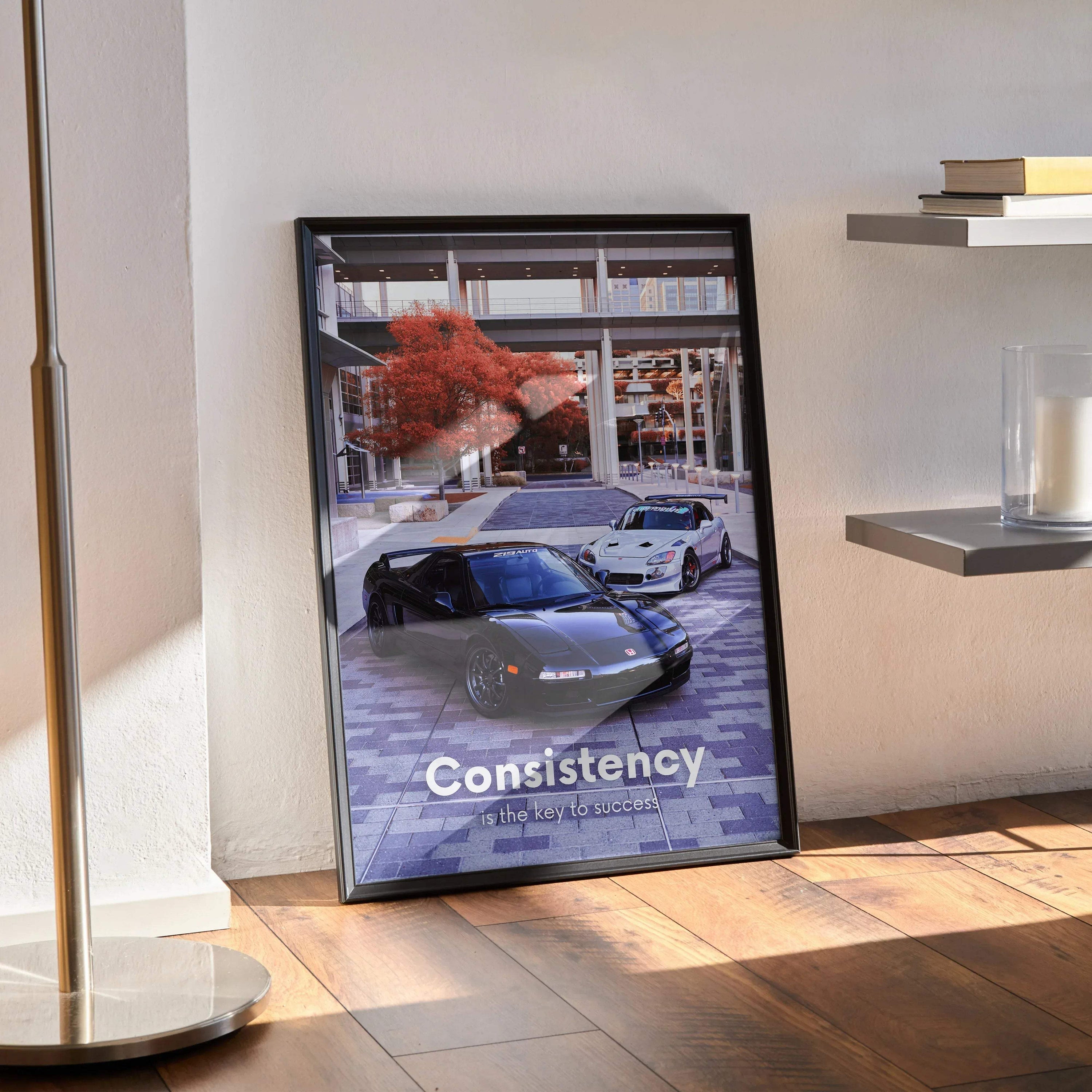 Motivational poster wall art featuring Acura NSX and Honda S2000 with "Consistency" text in black frame.