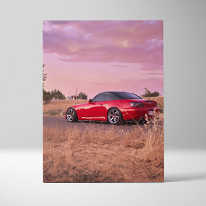 Red Honda S2000 sports car on dry grass at sunset vertical canvas wall art.