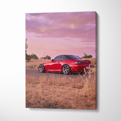 Red Honda S2000 sports car parked in dry grass under pink sunset sky vertical canvas wall art.