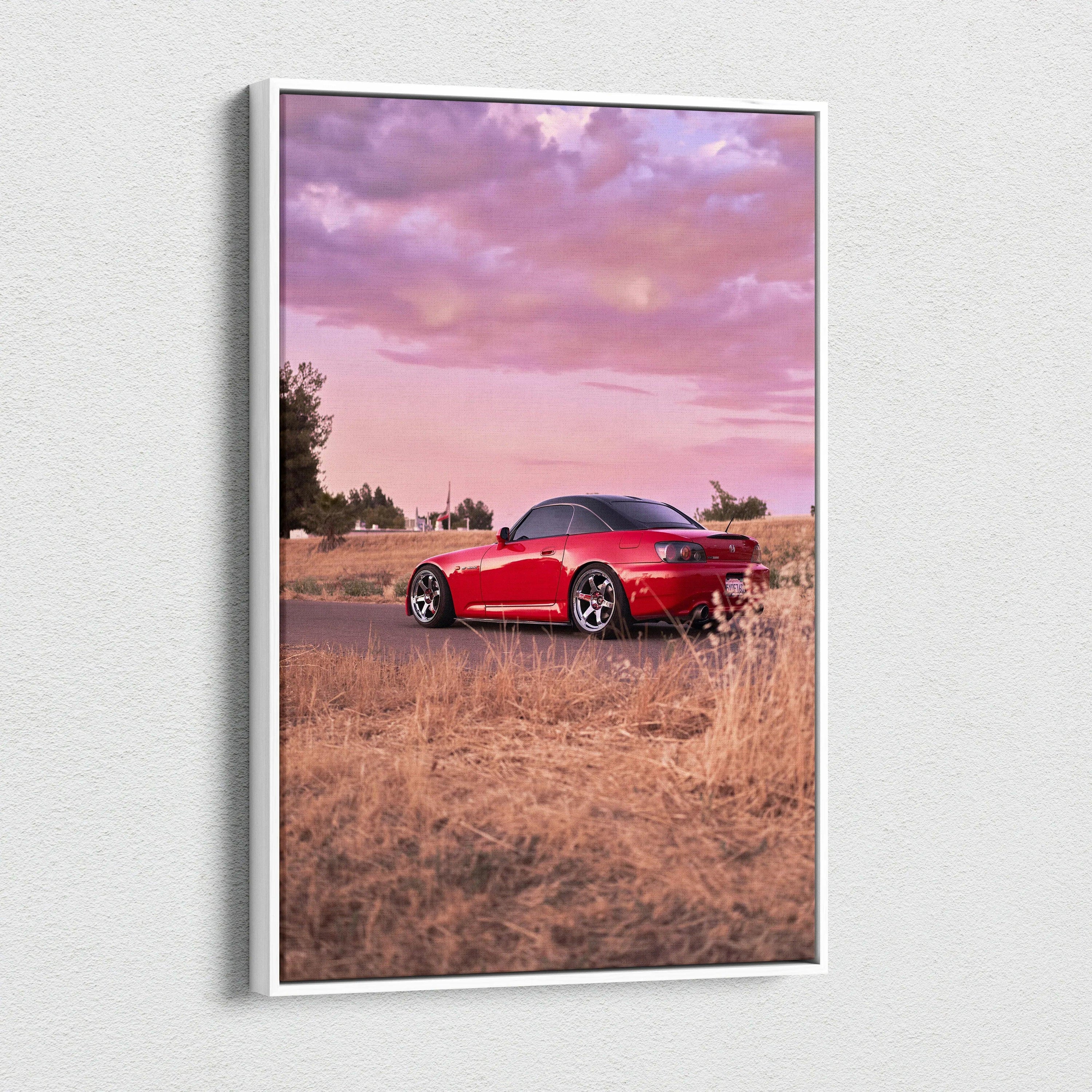 Honda S2000 red sports car at sunset on vertical canvas wall art with pink sky background.