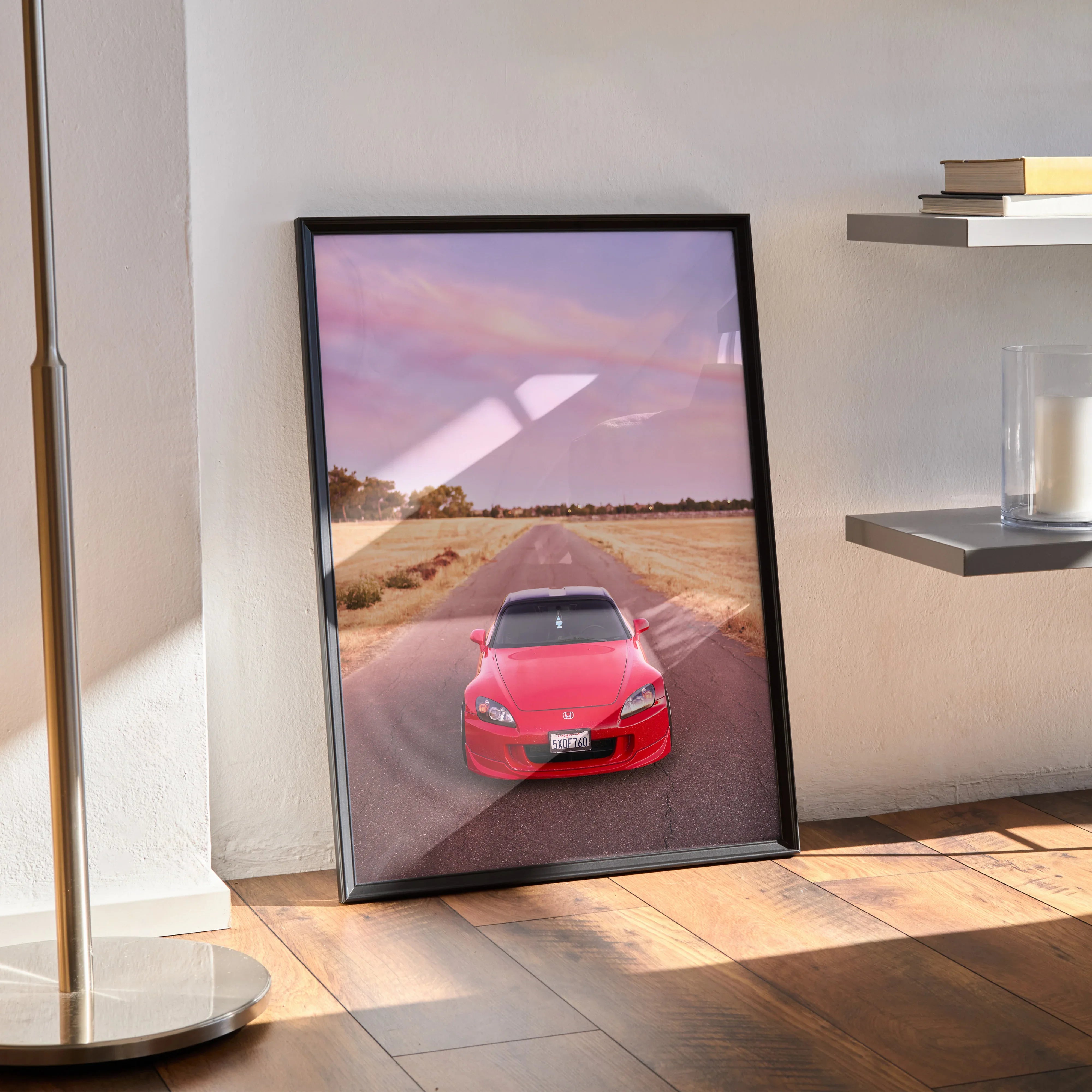 Honda S2000 red sports car driving on country road at sunset poster wall art in black frame.