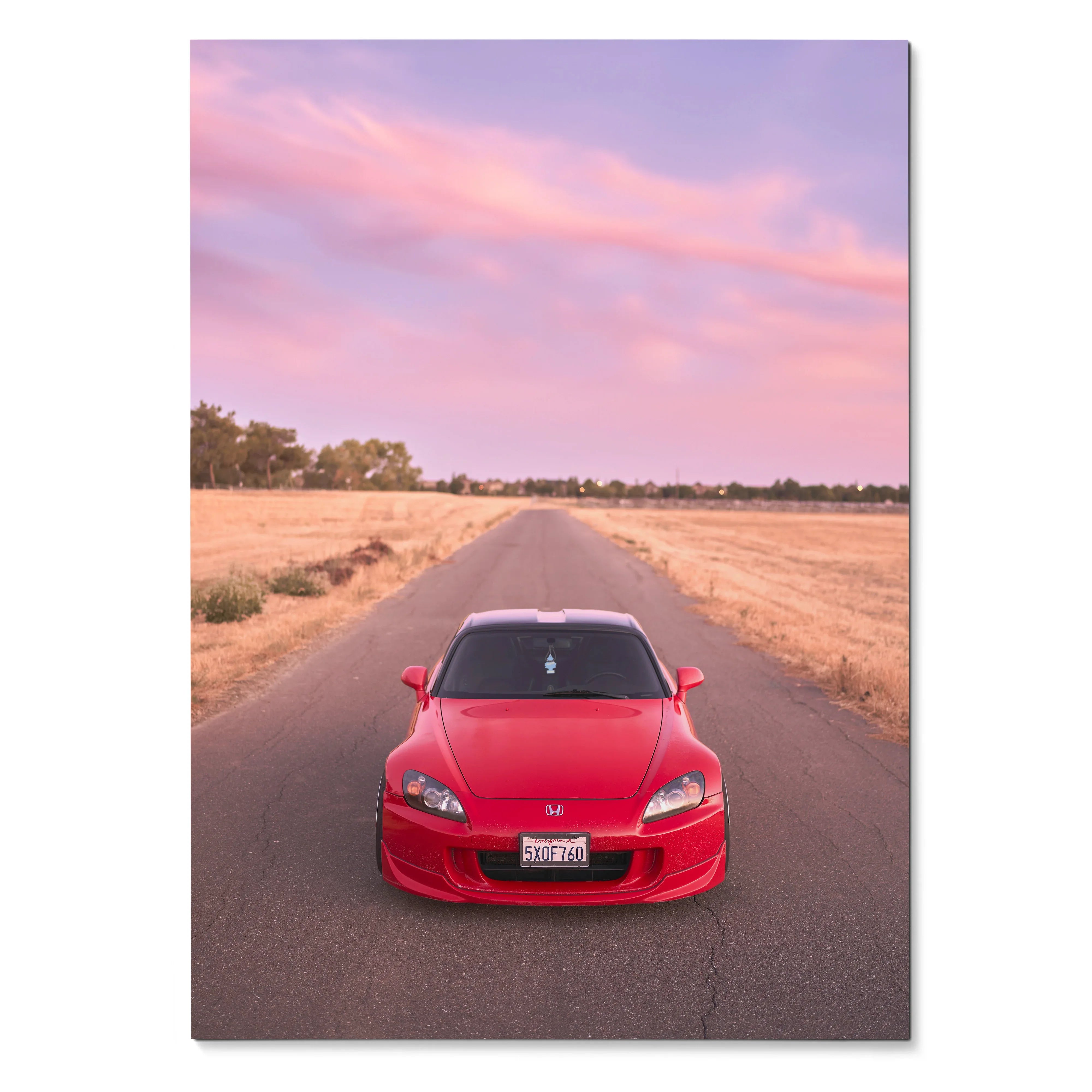 Red Honda S2000 on rural road at sunset, vibrant poster wall art with pink sky.