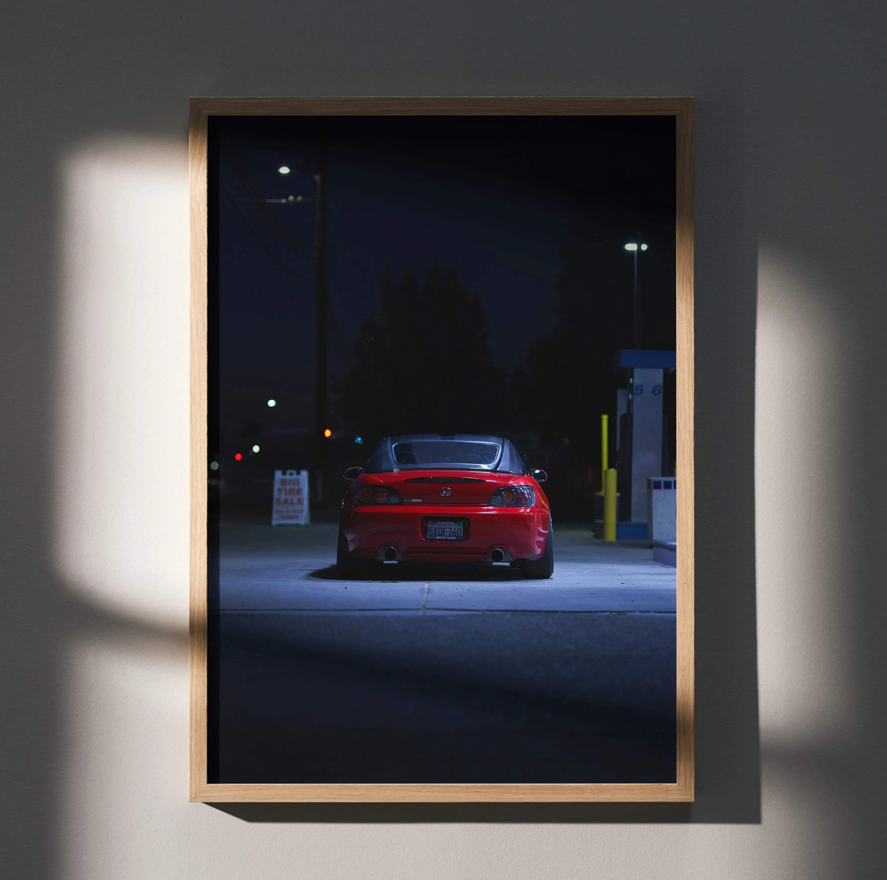 Honda S2000 poster wall art featuring rear view of red sports car at night in a wooden frame.