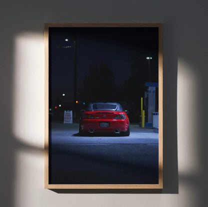 Honda S2000 poster wall art featuring rear view of red sports car at night in a wooden frame.