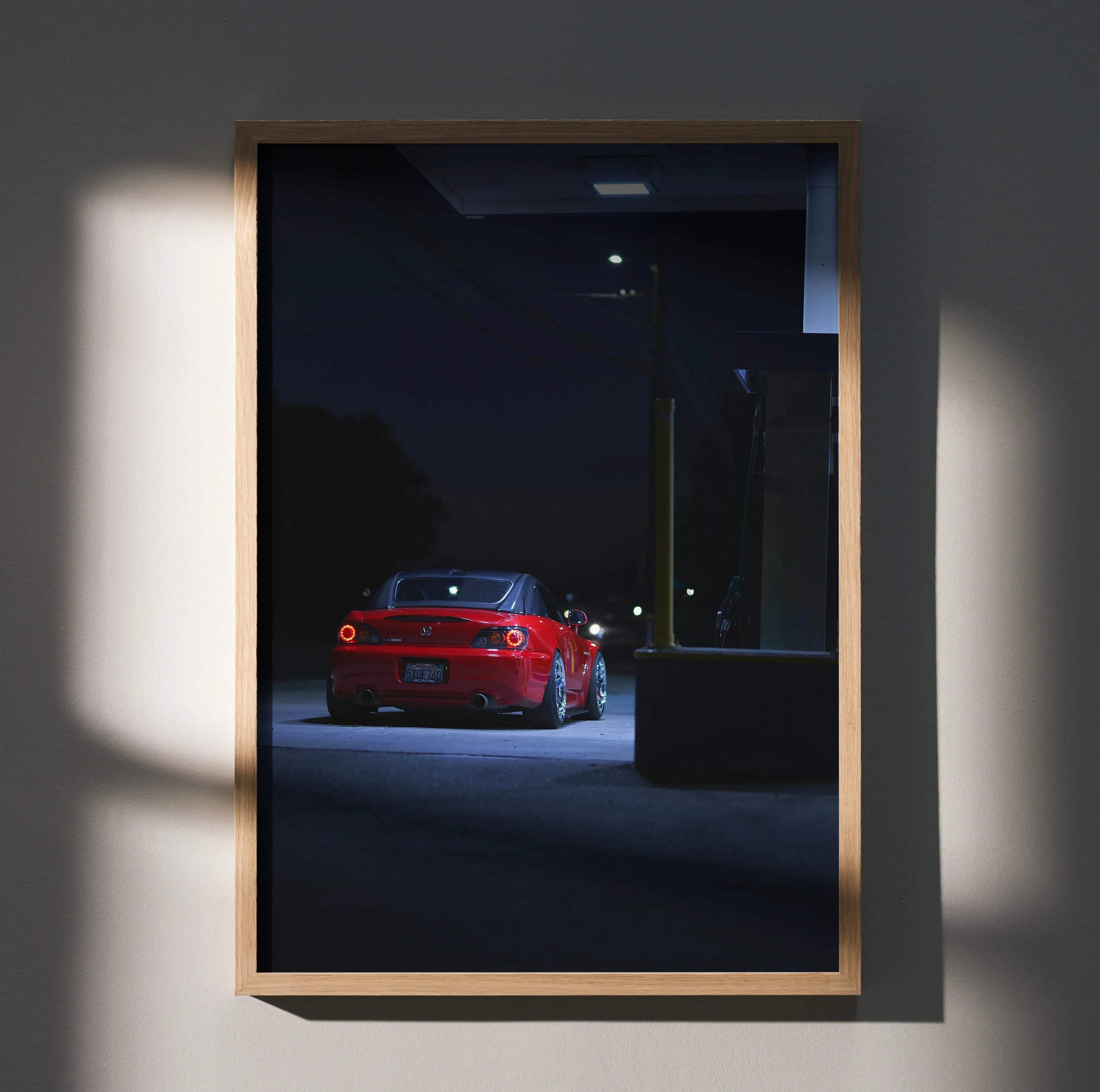 Honda S2000 red sports car at night poster wall art with moody lighting and urban background.