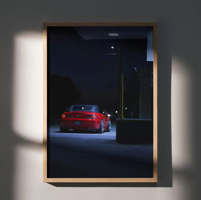 Honda S2000 red sports car at night poster wall art with moody lighting and urban background.