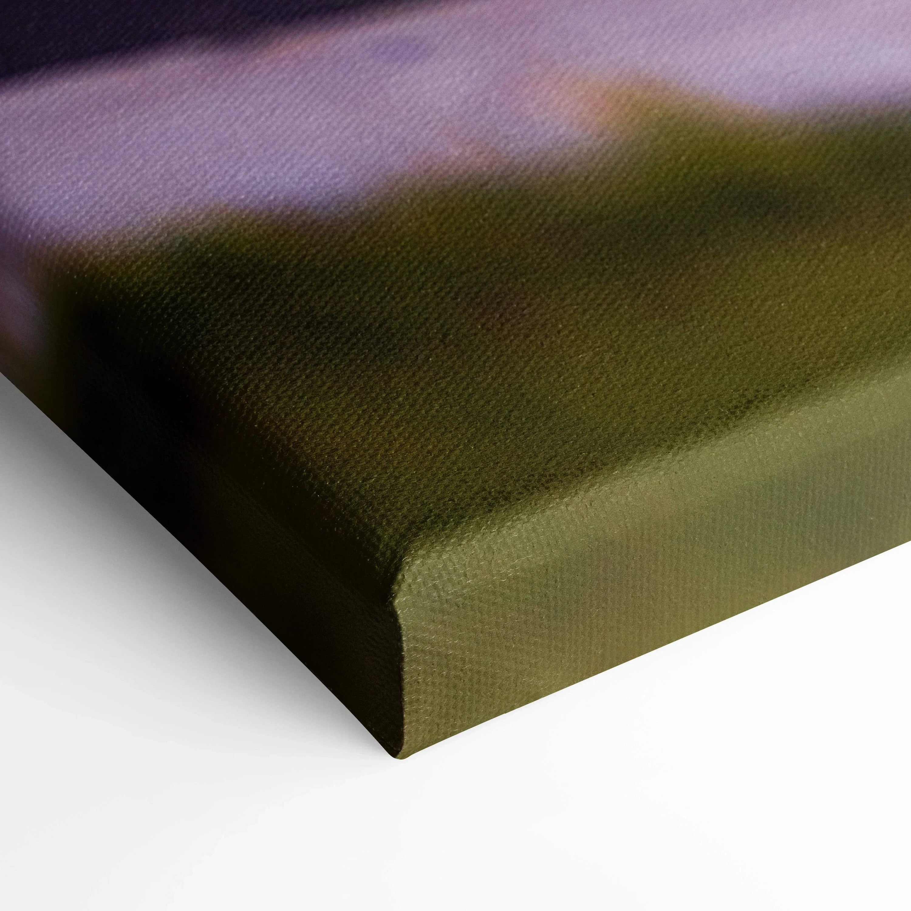 Close-up of textured canvas wall art corner showing detailed fabric weave and color gradient.
