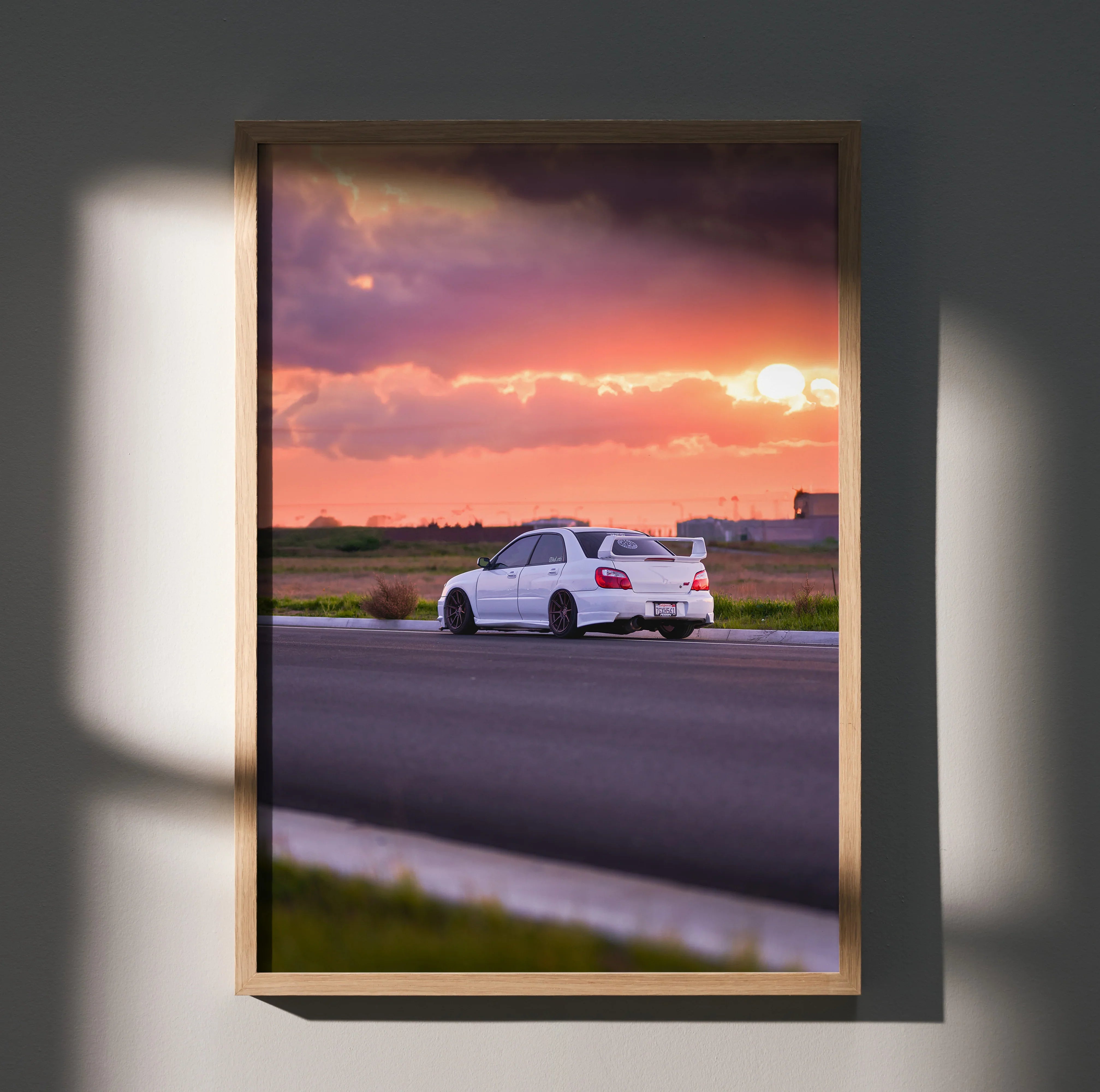 Subaru WRX STI #018 poster with white car driving on road at vibrant sunset, premium wall art.