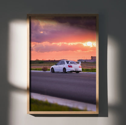 Subaru WRX STI #018 poster with white car driving on road at vibrant sunset, premium wall art.