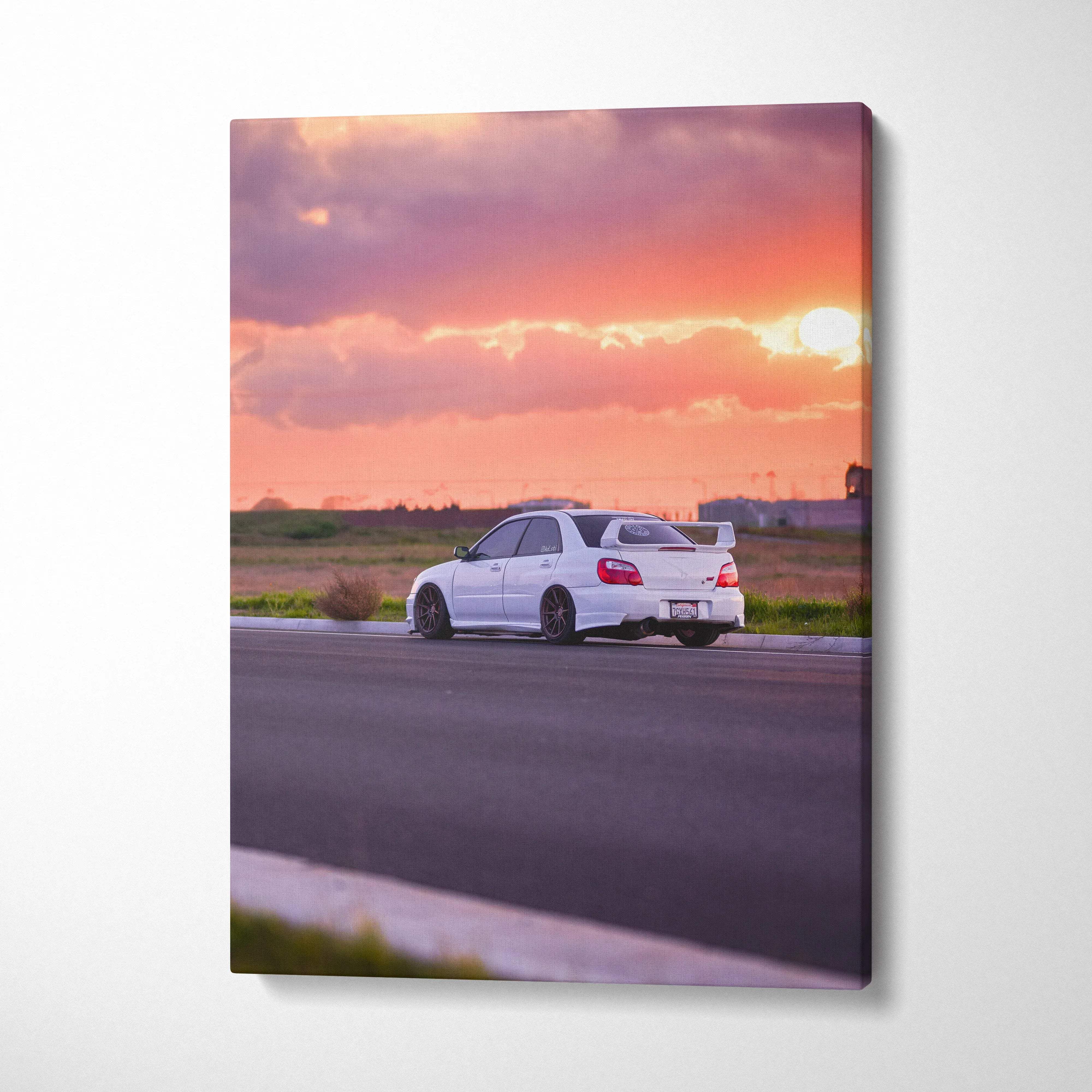 Subaru WRX STI on road at sunset canvas wall art with vibrant sky colors vertical print.