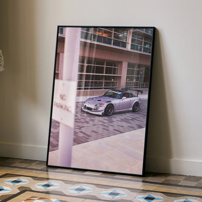 Honda S2000 silver sports car poster leaning against wall with urban building background wall art.