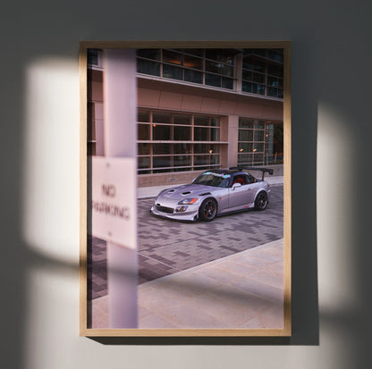 Honda S2000 convertible sports car poster displayed as framed wall art with urban background.