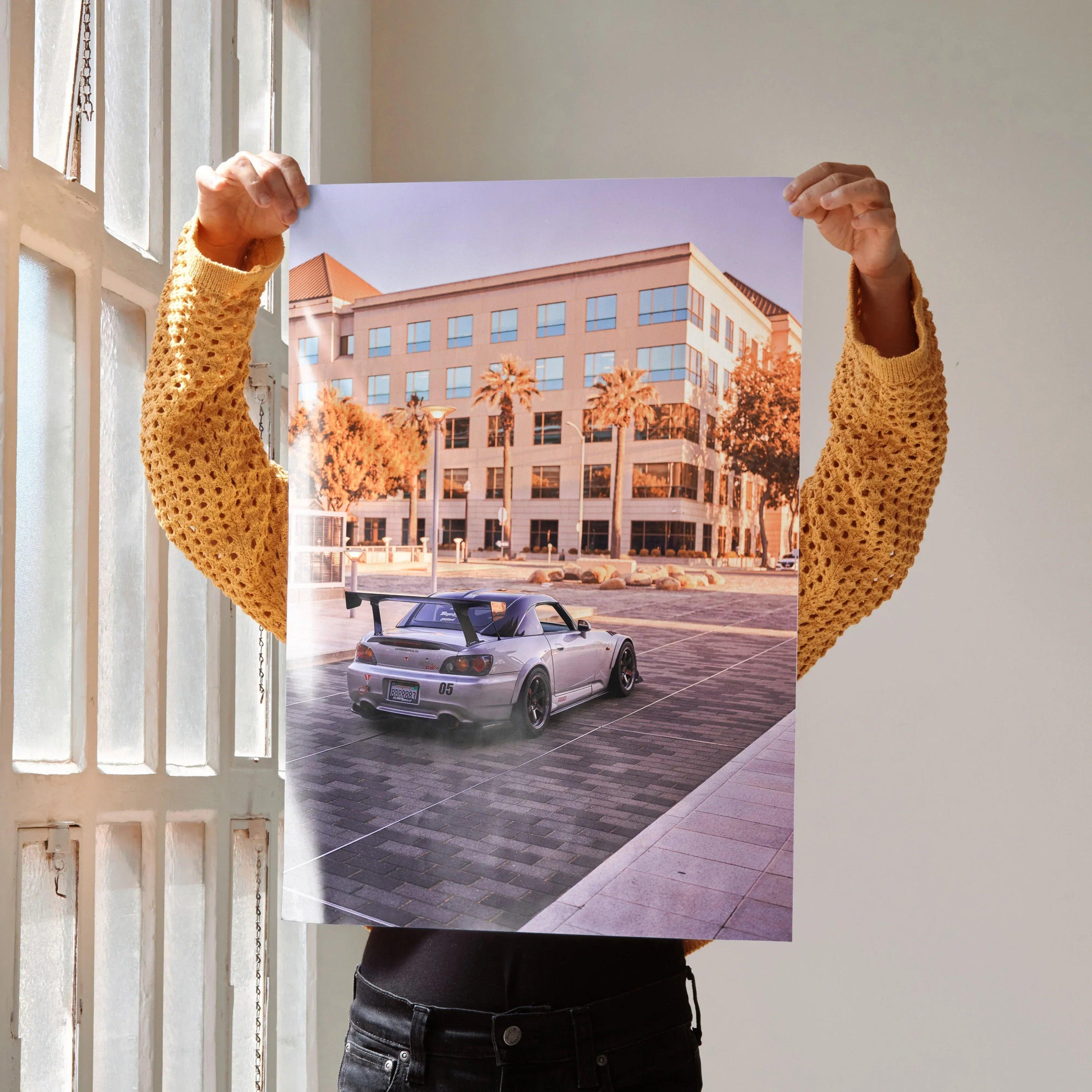 Honda S2000 poster featuring a silver sports car on urban street with palm trees wall art.