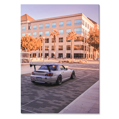 Honda S2000 parked in urban setting at sunset poster wall art with warm tones.
