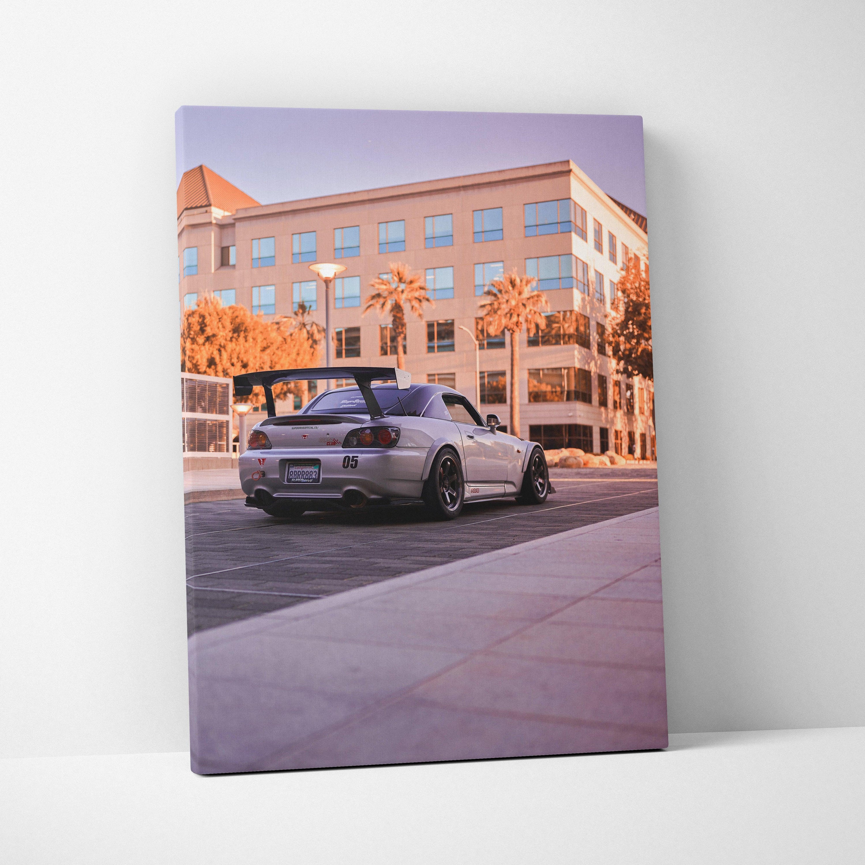 Honda S2000 sports car parked in front of modern building at sunset on vertical canvas wall art.