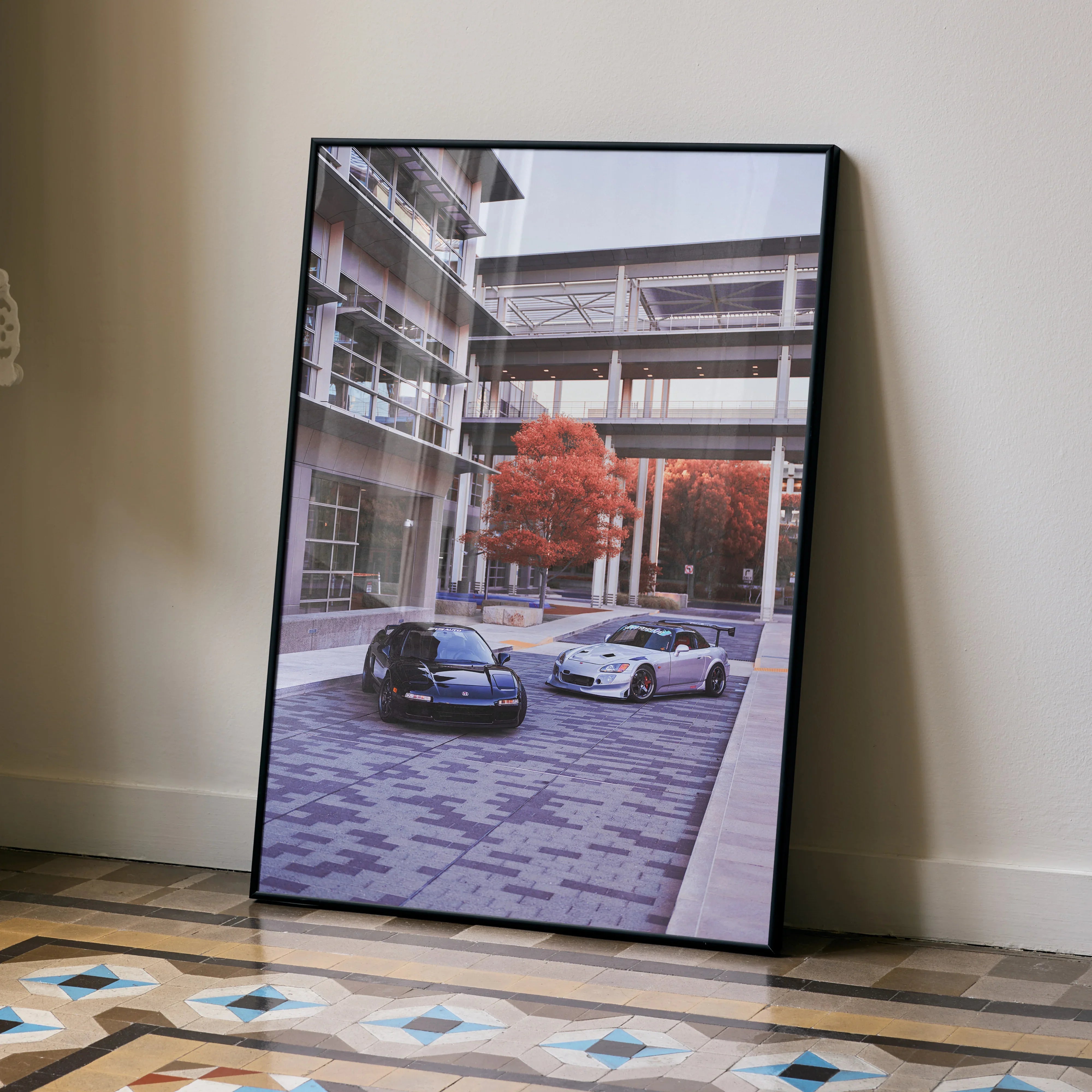 Framed poster wall art featuring Acura NSX and Honda S2000 parked near modern building with autumn trees.