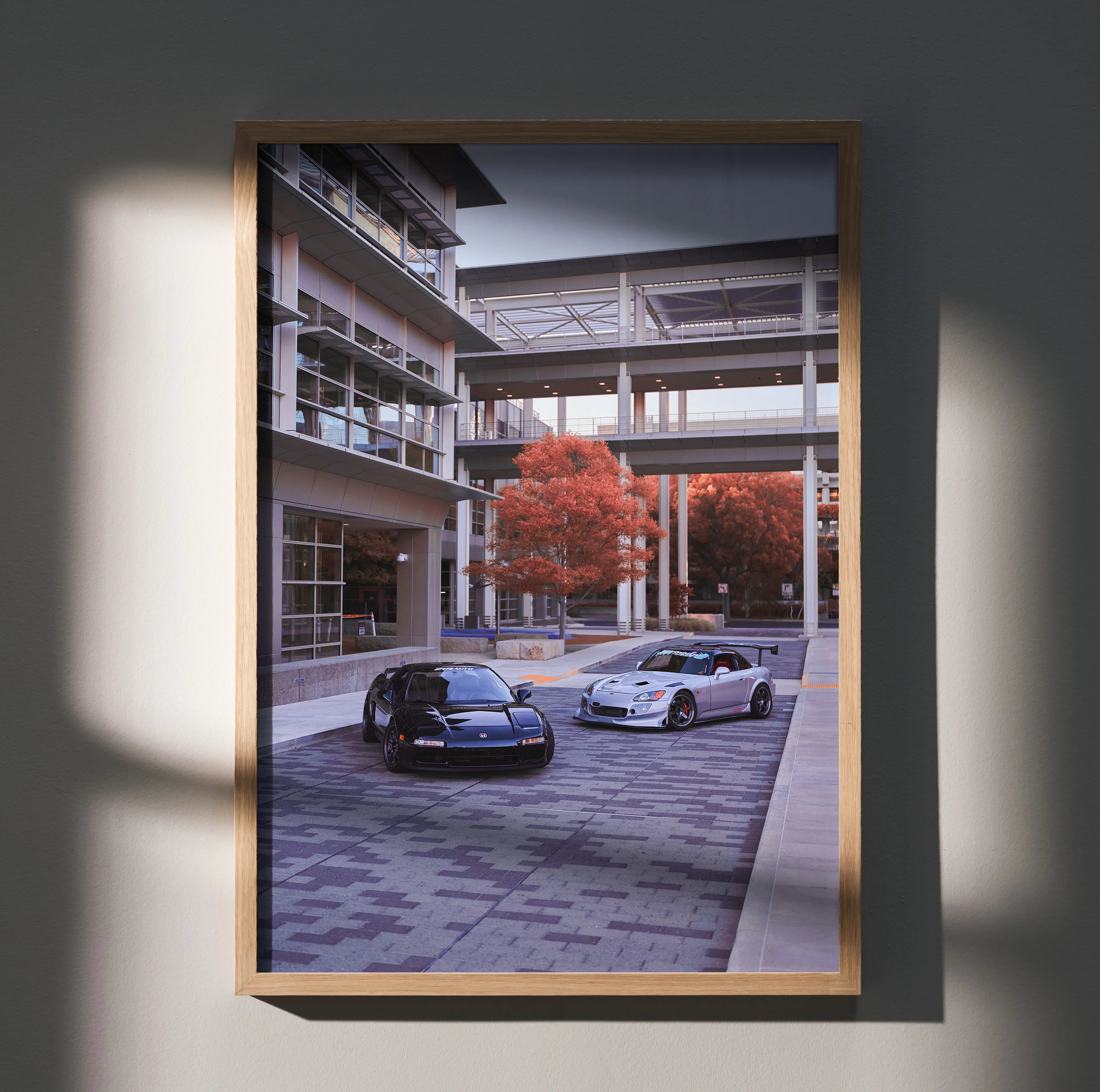 Acura NSX and Honda S2000 parked in urban courtyard poster wall art with red trees.