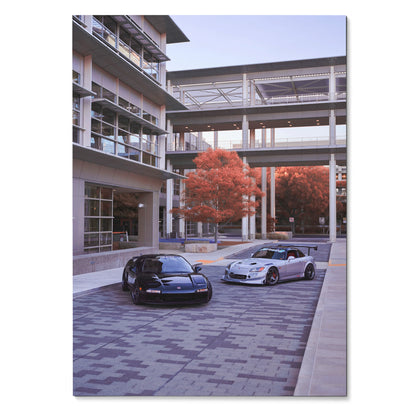 Poster wall art featuring black Acura NSX and silver Honda S2000 parked in modern urban setting with red autumn tree.