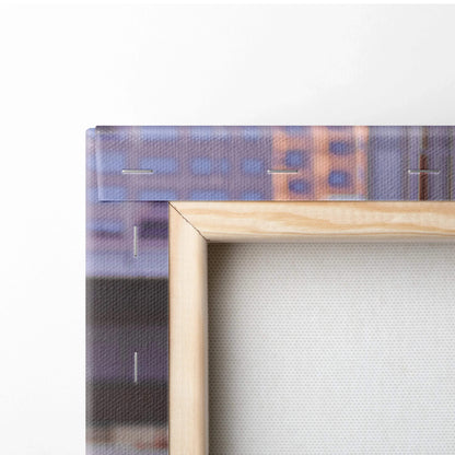 Close-up of wooden frame on vertical canvas art print with textured canvas wall art surface.