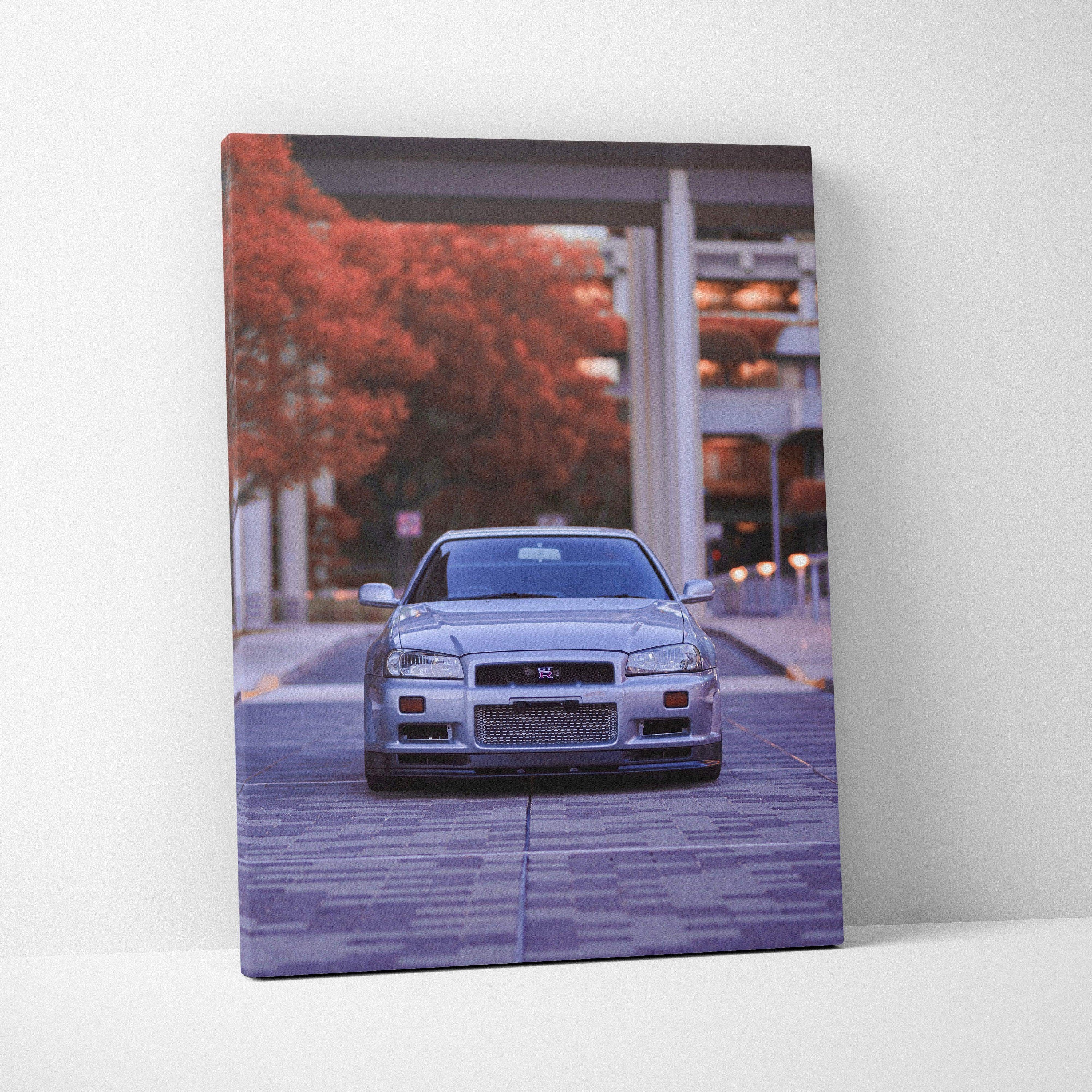 Vertical canvas wall art featuring a silver Nissan GTR R34 Skyline with autumn trees background.