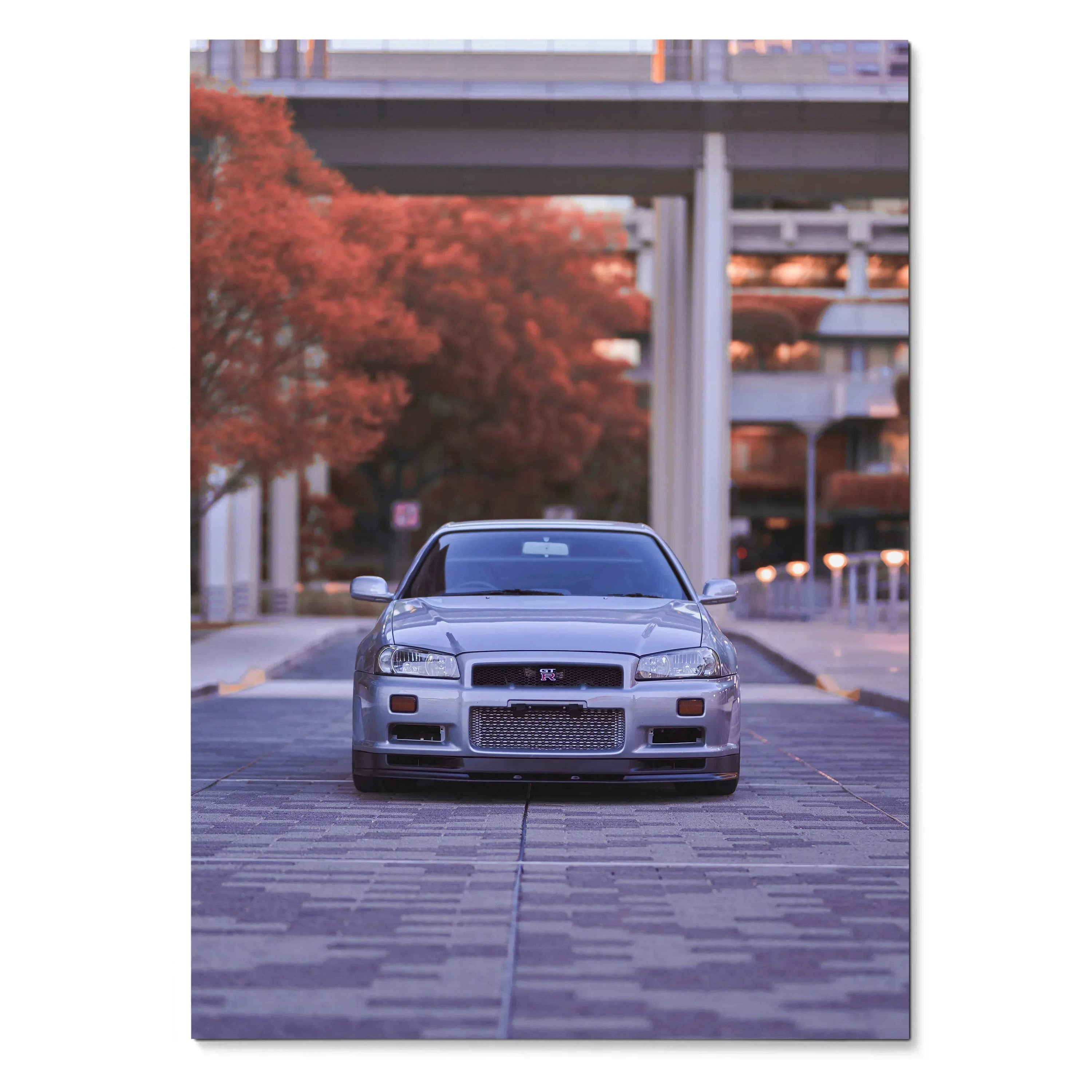 Nissan R34 GTR parked under urban bridge with autumn trees poster wall art.