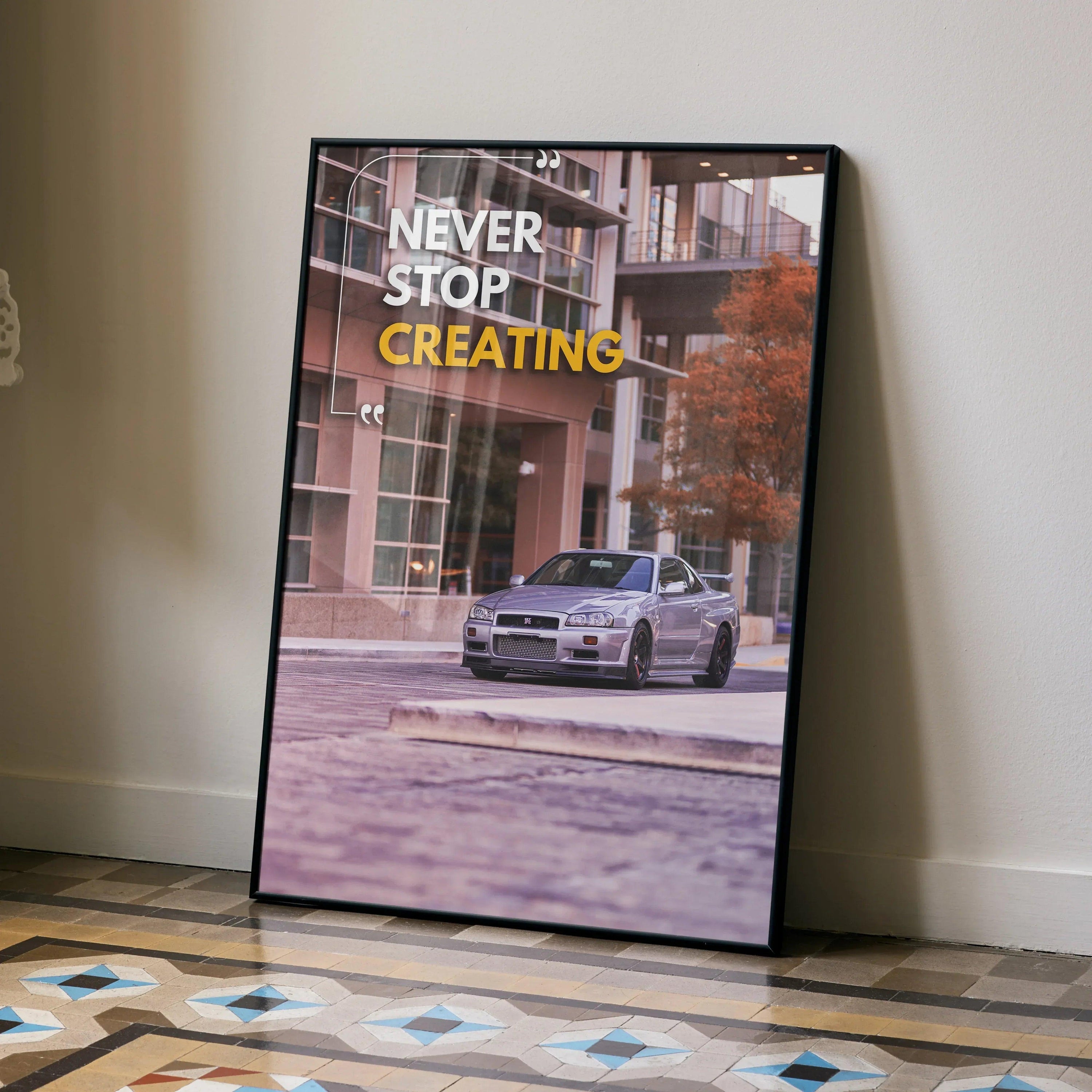Motivational poster wall art featuring silver Nissan GT-R R34 Skyline with inspiring text "Never Stop Creating" in modern.