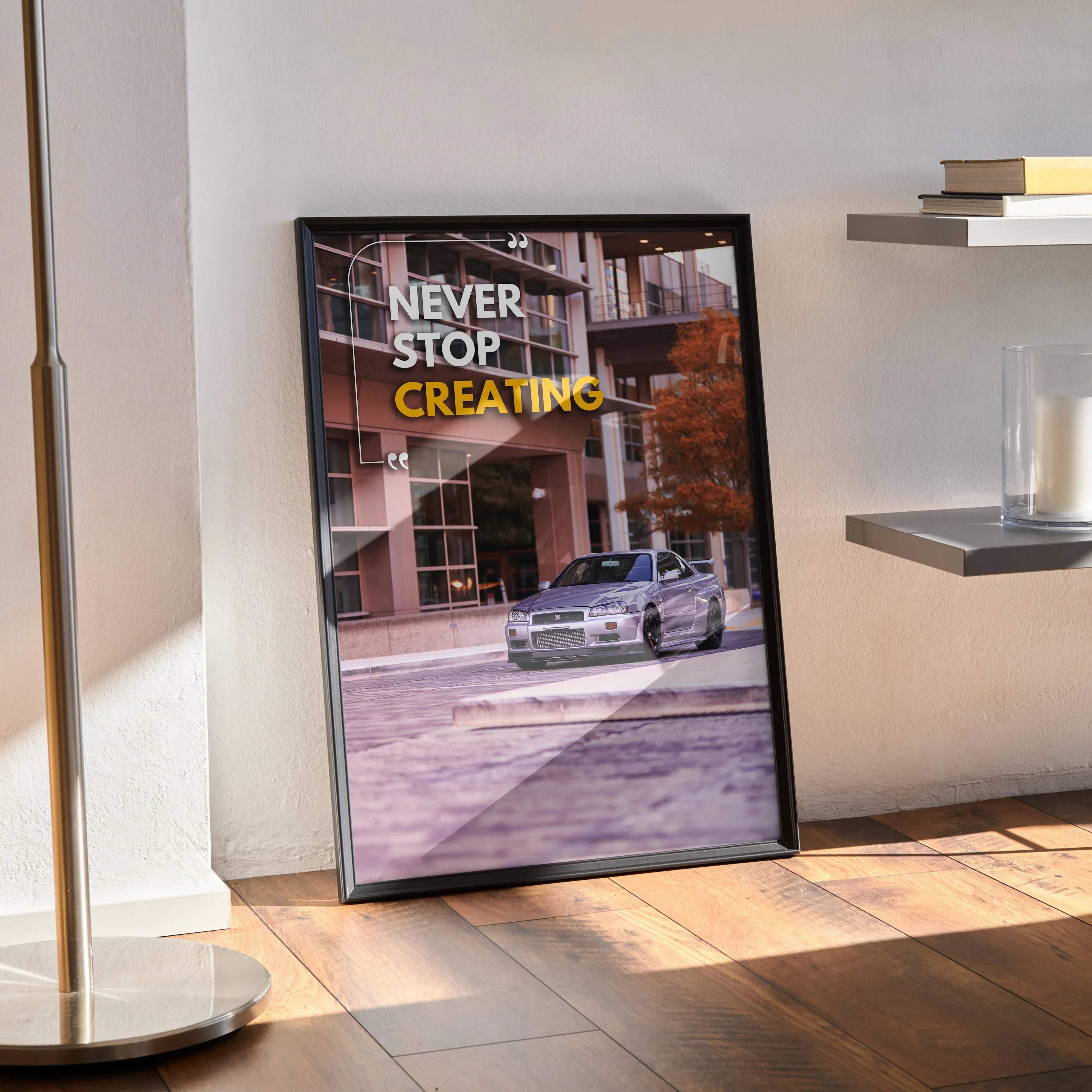 Black-framed motivational poster featuring a silver Nissan GT-R R34 Skyline with never stop creating text in white and yellow