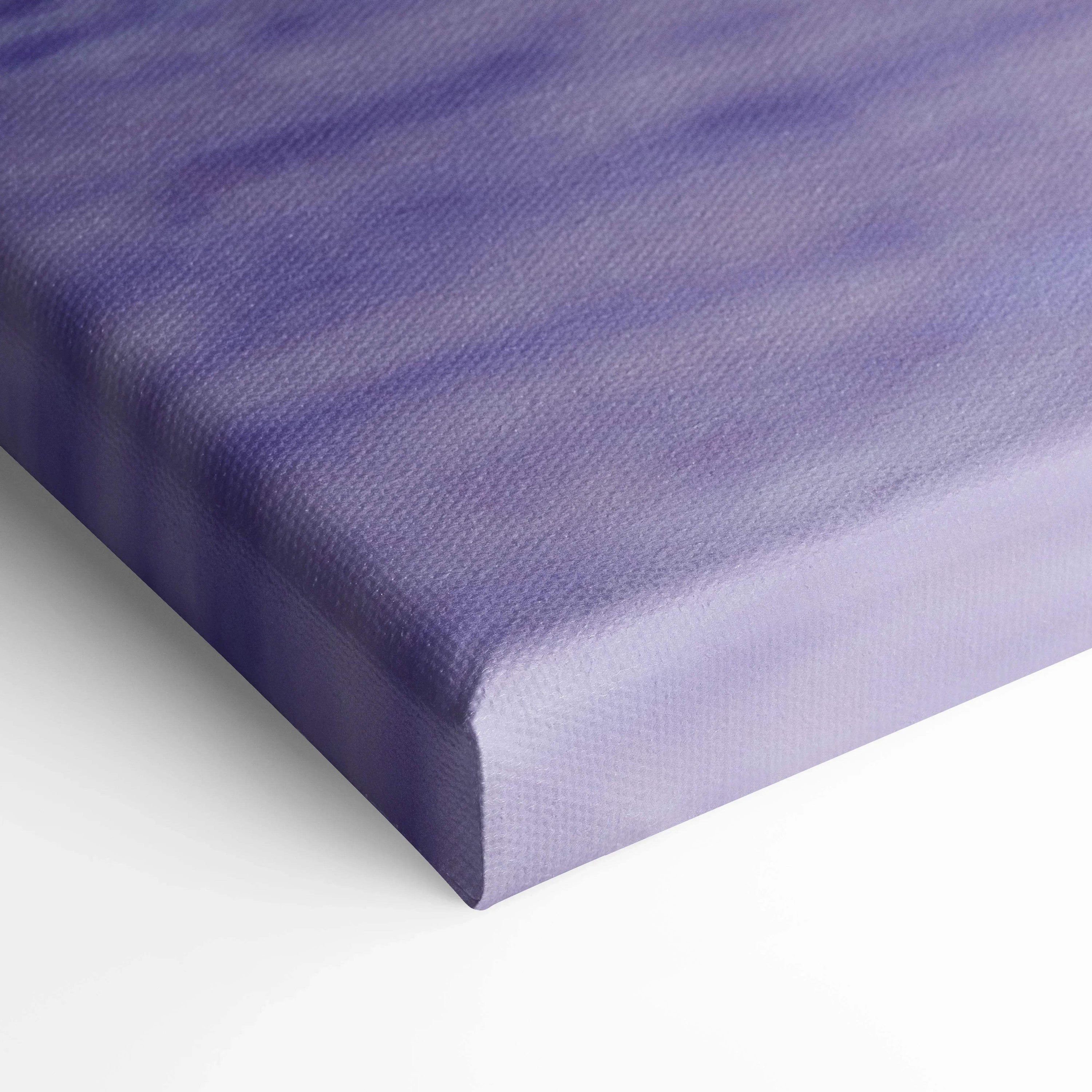 Close-up of purple gradient canvas corner showcasing textured fabric and wrapped edges for wall art display.