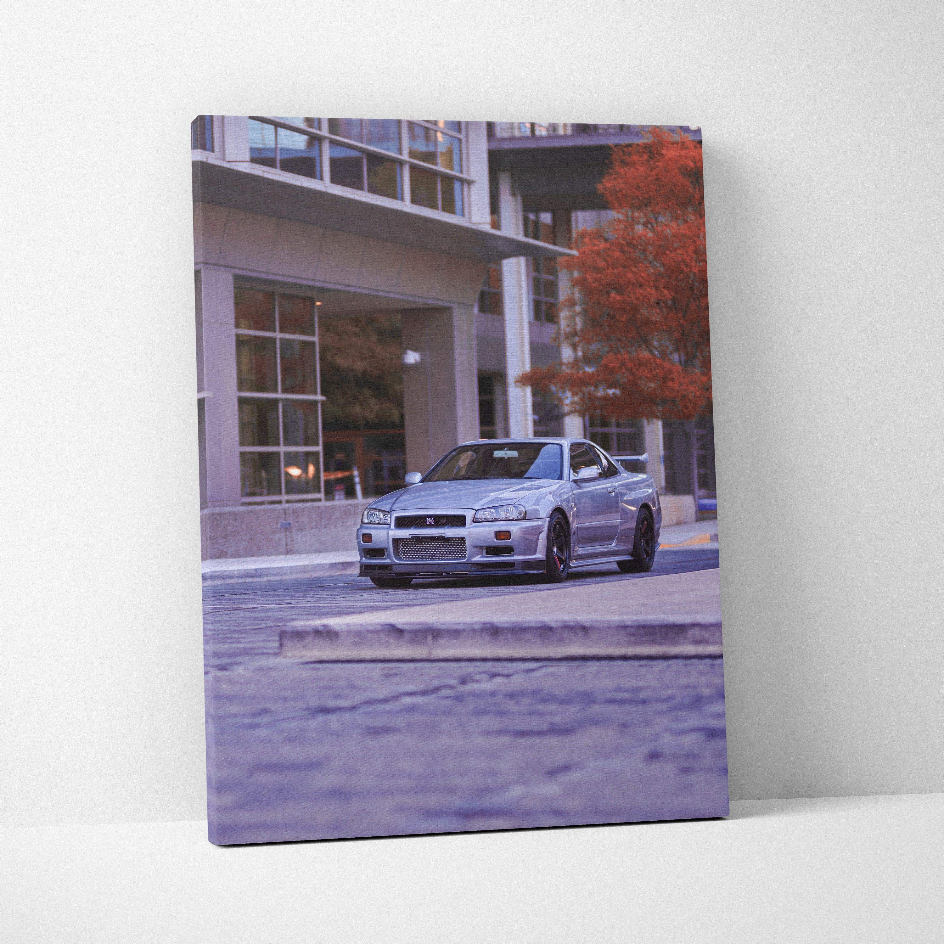Nissan GTR R34 Skyline parked by modern building canvas wall art in vertical format.