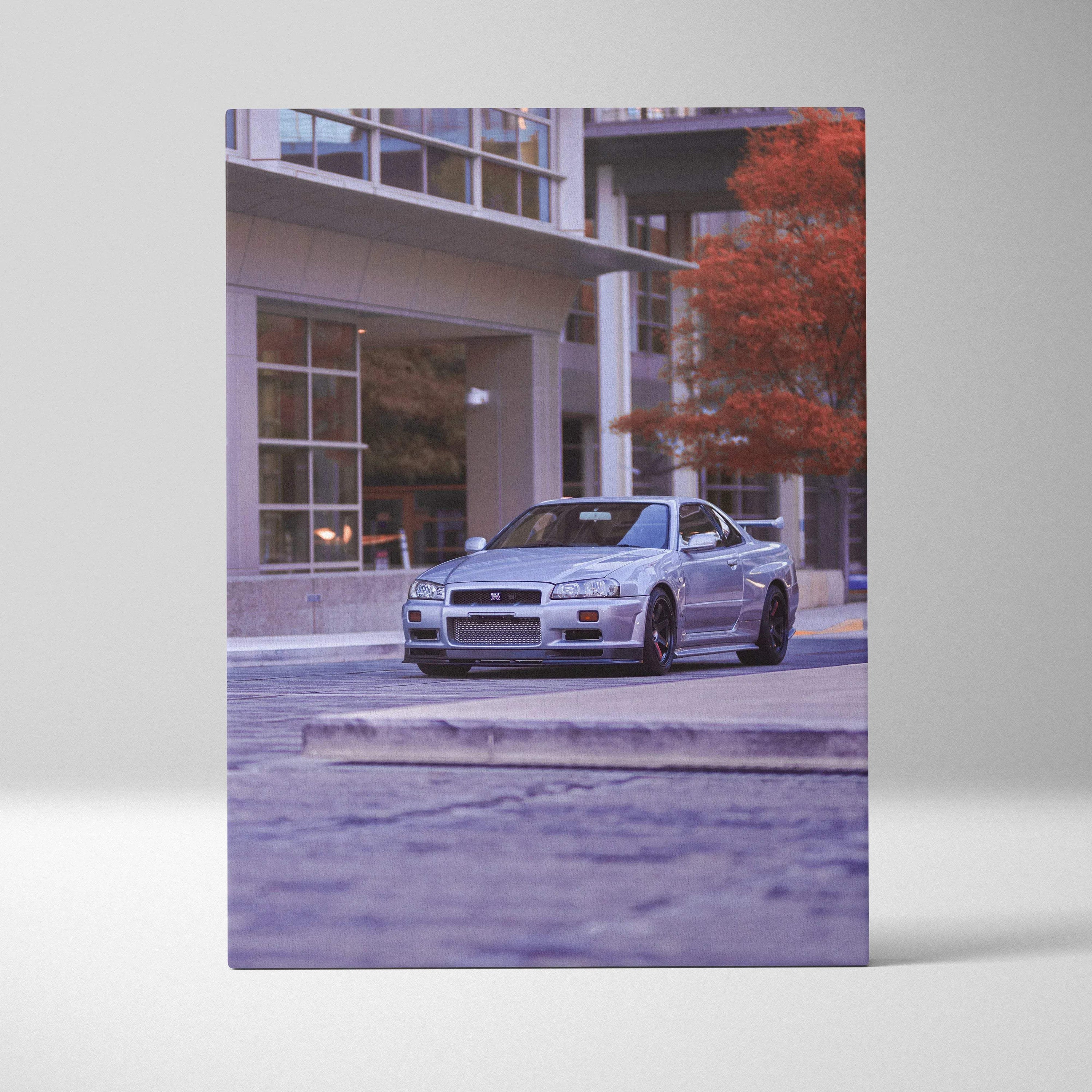 Silver Nissan GTR R34 Skyline parked near modern building with autumn tree canvas wall art.