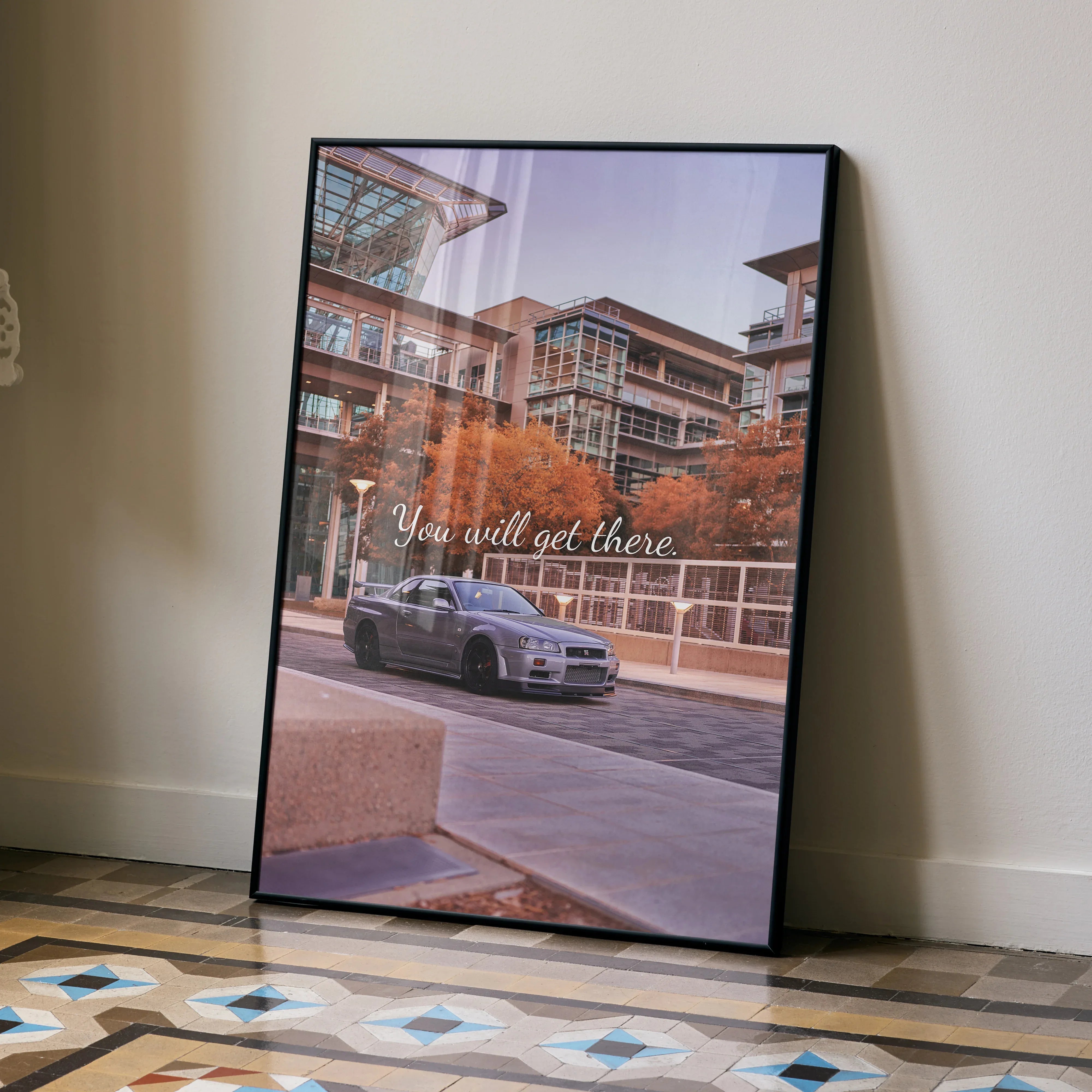 Nissan GT-R R34 Skyline parked in urban setting motivational poster wall art with inspirational quote.